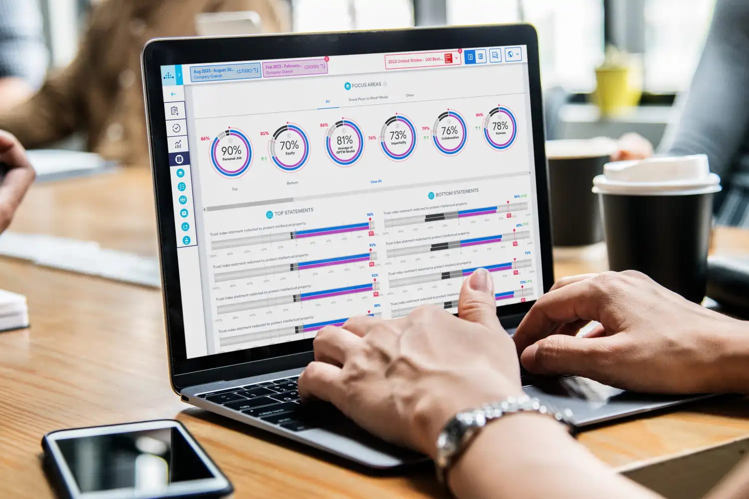 Laptop and phone showing survey app